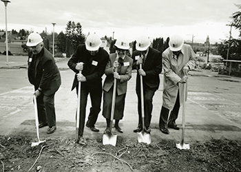 Seattle University Provost John Eshelman and others breaking ground (with shovels) on the site that would become Sullivan Hall.