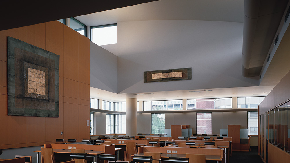Seattle U Law Library fourth floor - high ceiling, skylight above, study desks below