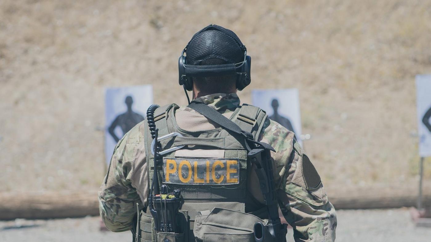 A police officer in military gear