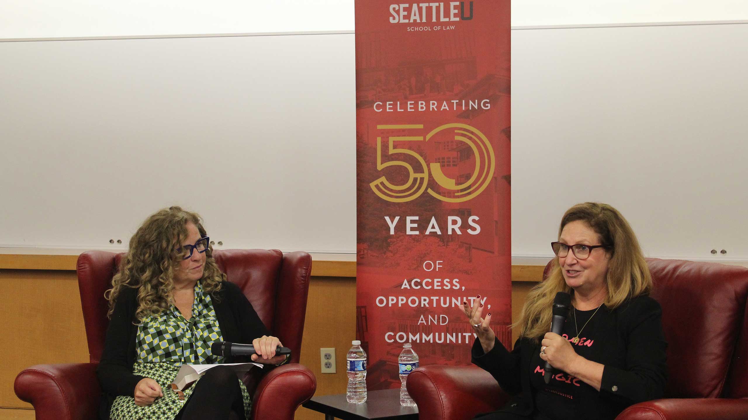 Seattle U Law Professor Deirdre Bowen (left) interviews Dahlia Lithwick (right).